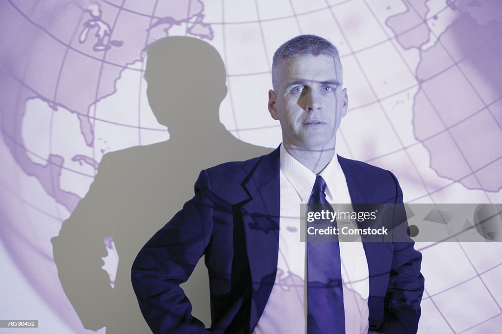 Businessman in front of globe