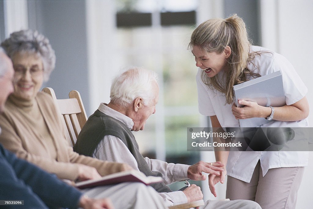 Nurse with man on porch