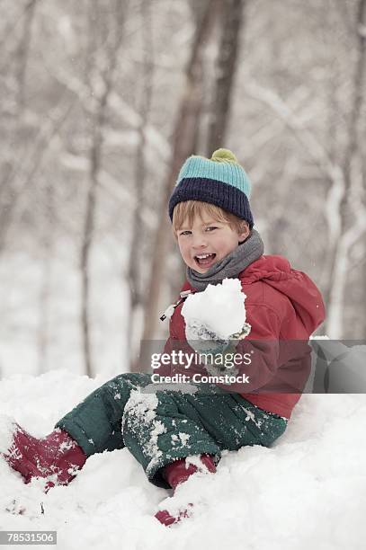 boy playing in snow - ski-wear stock pictures, royalty-free photos & images