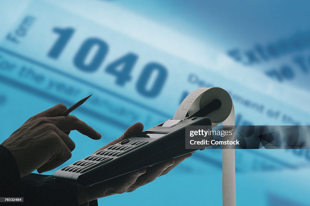 Composite of person with calculator and tax forms
