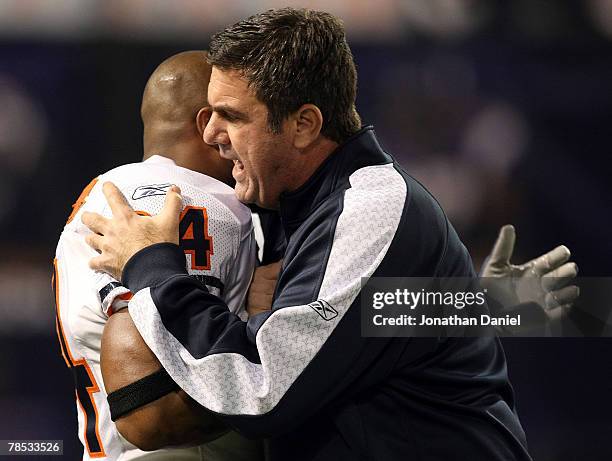 Defensive coordinator Bob Babich of the Chicago Bears hugs Ricky Manning Jr. #24 during warm-ups before a game against the Minnesota Vikings at the...