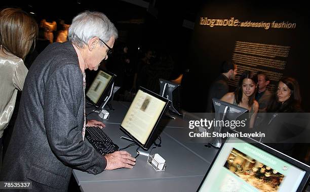 People look at computers at the "Blog.mode Addressing Fashion" reception at The Metropolitan Museum of Art on December 17, 2007 in New York City.