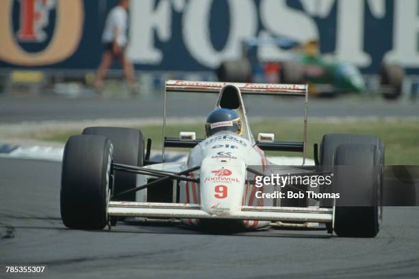 Italian racing driver Michele Alboreto drives the Footwork Arrows Racing Arrows A11B Ford Cosworth DFR 3.5 V8 in the 1990 British Grand Prix at...
