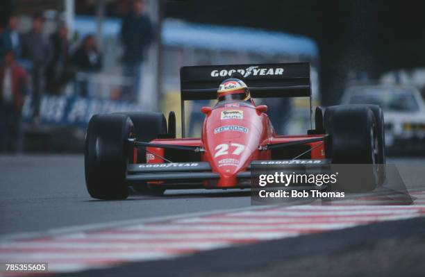 Italian racing driver Michele Alboreto , drives the Scuderia Ferrari SpA SEFAC Ferrari F1/87 Ferrari 033D 1.5 V6t in the 1987 Belgian Grand Prix at...