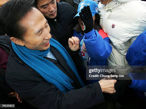 Presidential candidate Lee Myung-Bak of the conservative main opposition Grand National Party , meets with his supporters during a presidential...