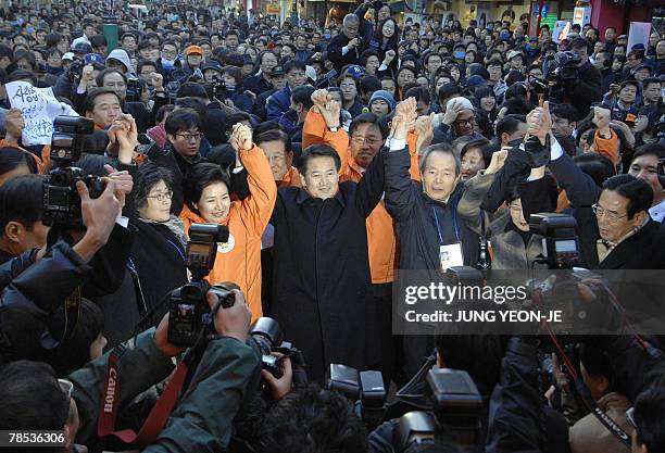 Chung Dong-Young , South Korean presidential candidate for the pro-government United New Democratic Party, poses for photographers as he campaigns in...