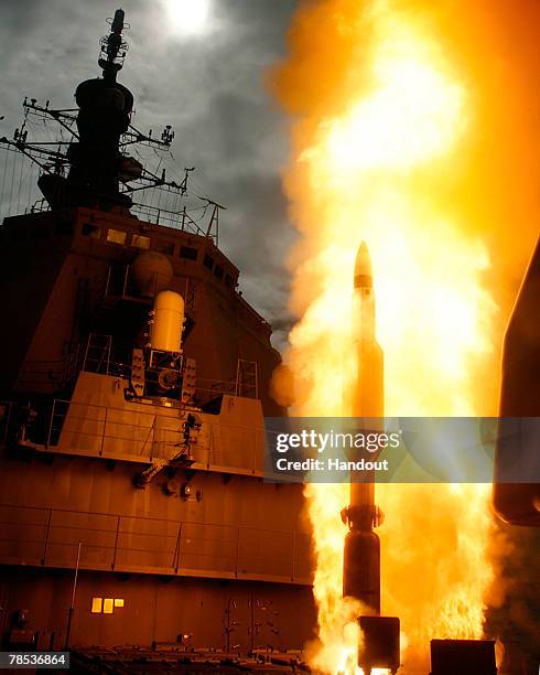 In this handout photo released by the Japan Maritime Self Defense Force, a Standard Missile 3 is launched from the Japan Maritime Self Defense Force...