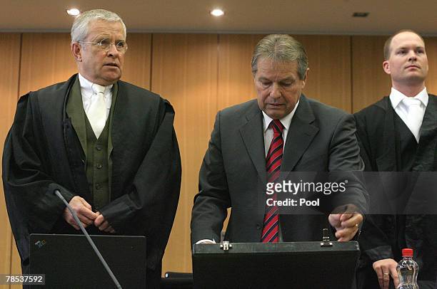 Former head of the Volkswagen workers, Klaus Volkert , and his lawyer Johann Schwenn are seen on the fourth day of the Volkswagen trial on December...