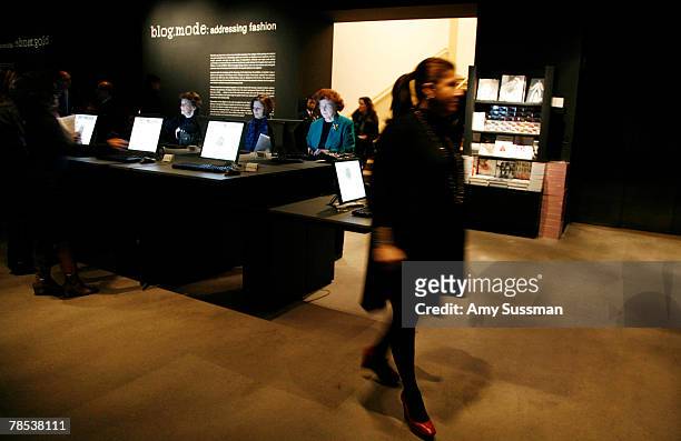 People sit at computers at the "Blog.mode: addressing fashion" exhibit at the Metropolitan Museum of Art's Costume Institute on December 17, 2007 in...