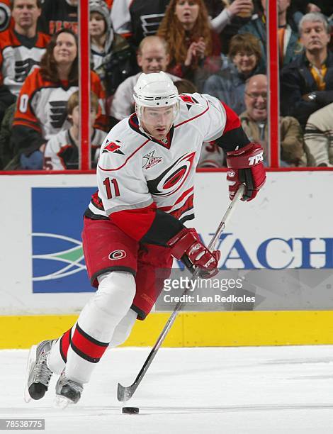 Justin Williams of the Carolina Hurricanes skates with the puck in a NHL game against the Philadelphia Flyers on December 15, 2007 at the Wachovia...