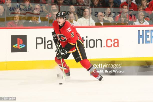 Dion Phaneuf of the Calgary Flames carries the puck against the St. Louis Blues on December 4, 2007 at Pengrowth Saddledome in Calgary, Alberta,...