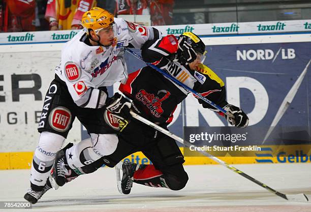 Peter Smrek of Frankfurt challenges Rene Rothke of Hanover during the German Cup semi final match between Hanover Scorpions and Frankfurt Lions at...