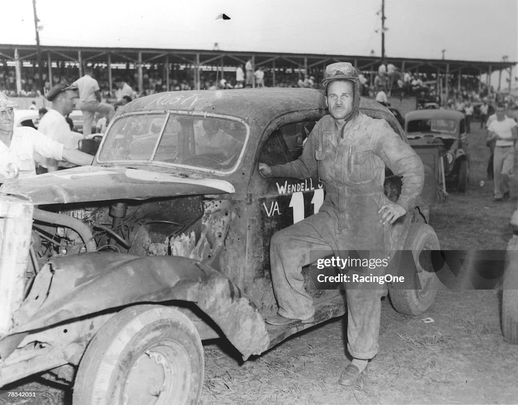 Wendall Scott Poses by Homebuilt Modified Race Car