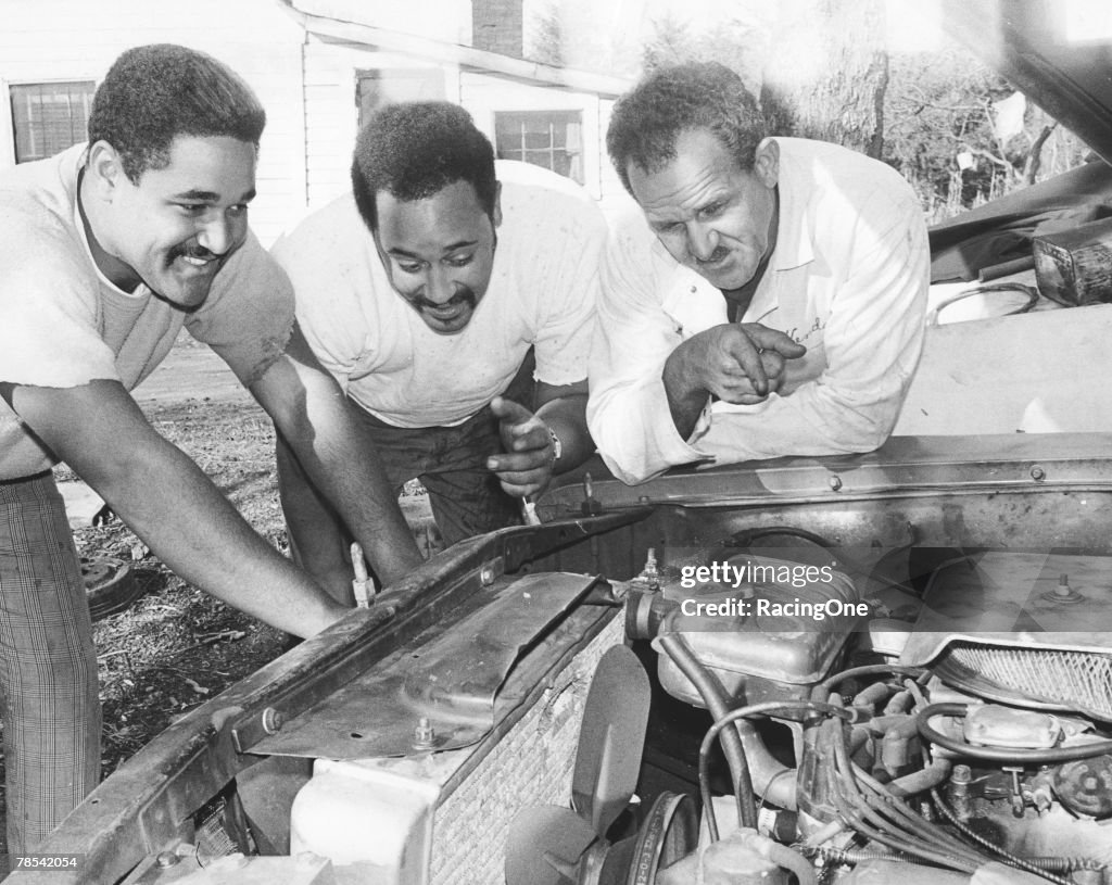 Wendell Scott and Sons Work on Engine