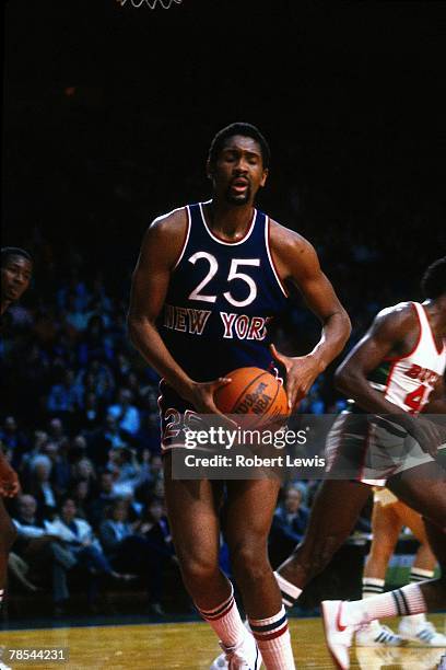 Bill Cartwright of the New York Knicks grabs a rebound against the Milwaukee Bucks during an 1980s NBA game at the MECCA in Milwaukee, Wisconsin....