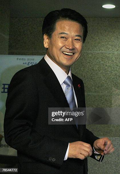 South Korea's United New Democratic Party presidential candidate Chung Dong-Young smiles before casting his ballot in the country's presidential...