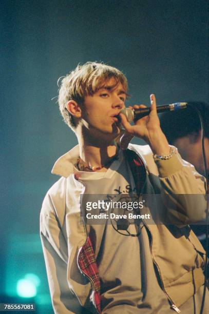 Singer Damon Albarn performing 'Girls & Boys' with Blur at the 1995 Brit Awards, held at Alexandra Palace, London, 20th February 1995. Blur won a...