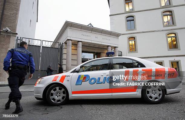 Policemen and car are seen in front of Geneva's Law Court 19 December 2007 during a public hearing of Cecile Brossard who confessed on 2005 the...