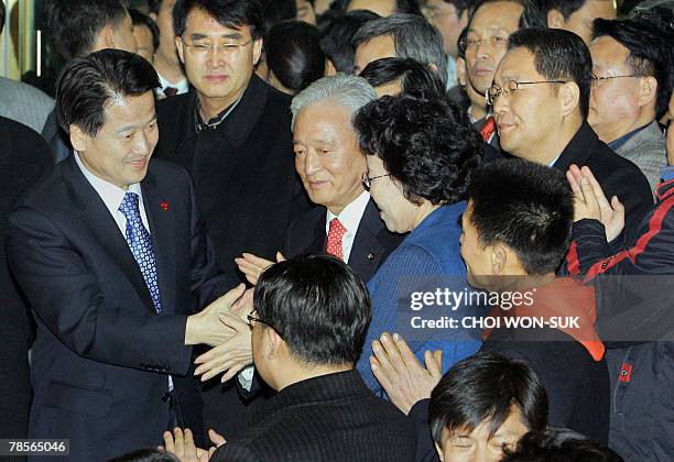 South Korea's United New Democratic Party presidential candidate Chung Dong-Young thanks supporters and party members as he leaves party headquarters...