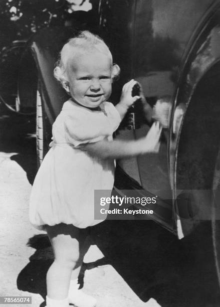One year-old Prince Carl Gustaf Folke Hubertus of Sweden visiting his great-grandfather, King Gustav V, at Solliden Palace on the island of Oeland,...