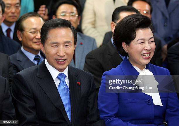 Lee Myung-Bak of the conservative main opposition Grand National Party and his wife Kim Yoon-Ok smile after he is declared the winner of the...
