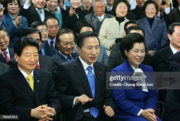 Lee Myung-Bak of the conservative main opposition Grand National Party , sits beside his wife Kim Yoon-Ok as he is declared the winner of the...