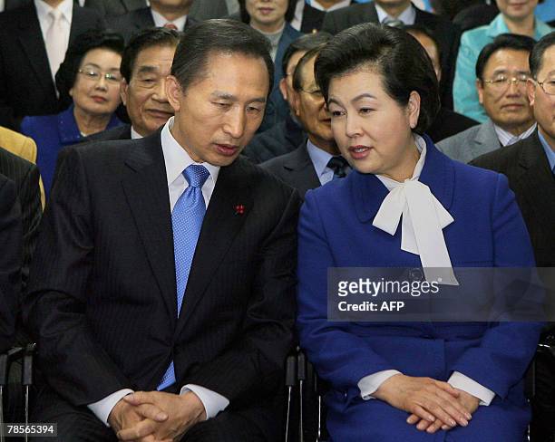 Grand National Party presidential candidate Lee Myung-Bak speaks to his wife Kim Yun-Ok before giving a speech to party members and supporters at GNP...