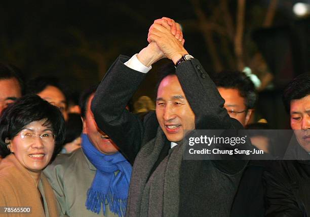 Lee Myung-Bak of the conservative main opposition Grand National Party , celebrates with his supporters after he is declared the winner of the...