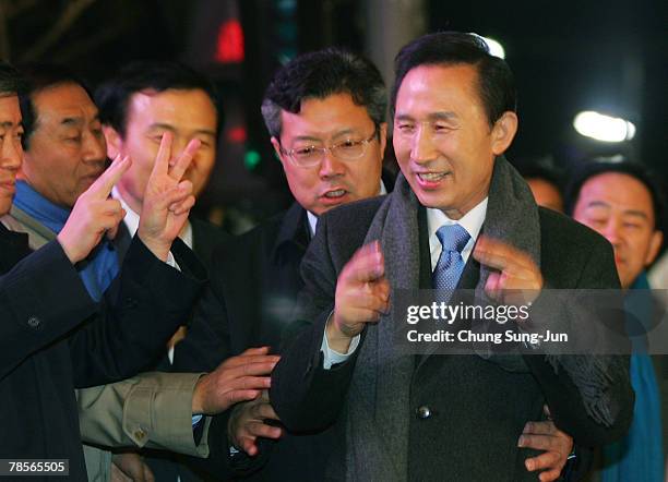 Lee Myung-Bak of the conservative main opposition Grand National Party , celebrates with his supporters after he is declared the winner of the...