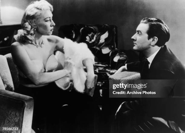 American filmmaker Edward D. Wood Jr. Watches actress Dolores Fuller remove her white angora sweater in a still from the film 'Glen Or Glenda', 1953.