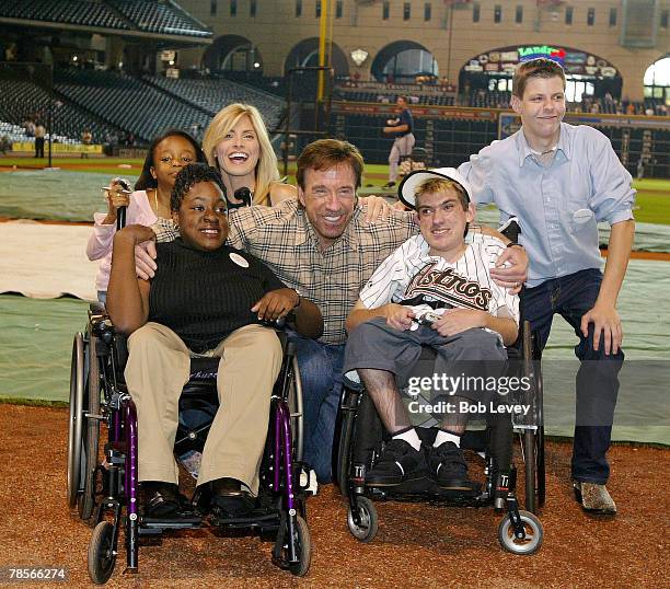 Chuck Norris and wife Gina pose with 4 children who requested to meet the action adventure star through the Make-A-Wish Foundation.The Houston Astros...