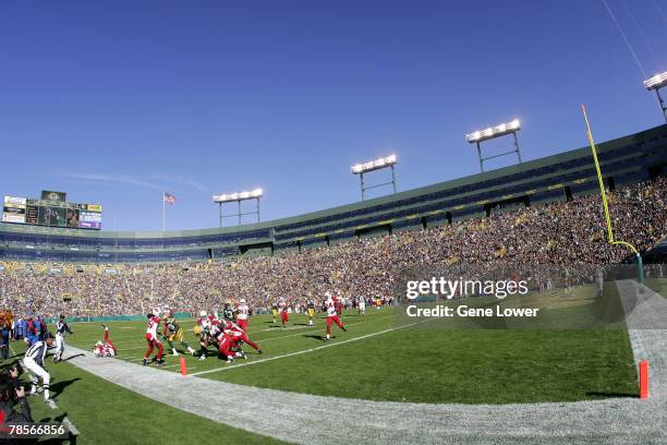 Arizona Cardinals defensive players make a key tackle short of the goal line during game against the Green Bay Packers at Lambeau Field in Green Bay,...