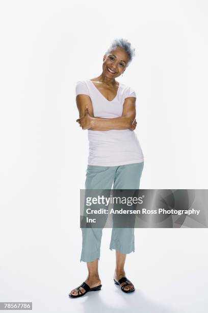 senior african american woman with arms crossed - black woman arms crossed stock pictures, royalty-free photos & images