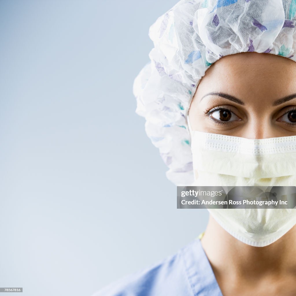 African American female medial professional wearing surgical mask