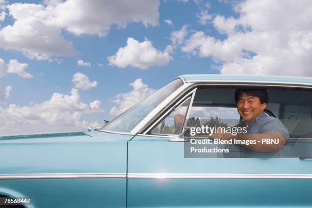 asian man sitting in car - inside car ストックフォトと画像