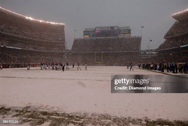 Heavy snowfall and high winds where the order of the day during a game between the Buffalo Bills and Cleveland Browns on December 16, 2007 at...