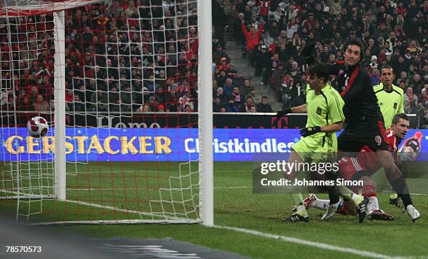 Luca Toni of Bayern scores 1-0 during the UEFA Cup Group F match between Bayern Munich and Aris Saloniki at the Allianz Arena on December 19, 2007 in...