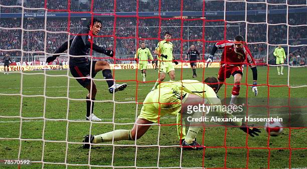 Luca Toni of Munich scores the second goal during the UEFA Cup Group F match between Bayern Munich and Aris Saloniki at the Allianz Arena on December...