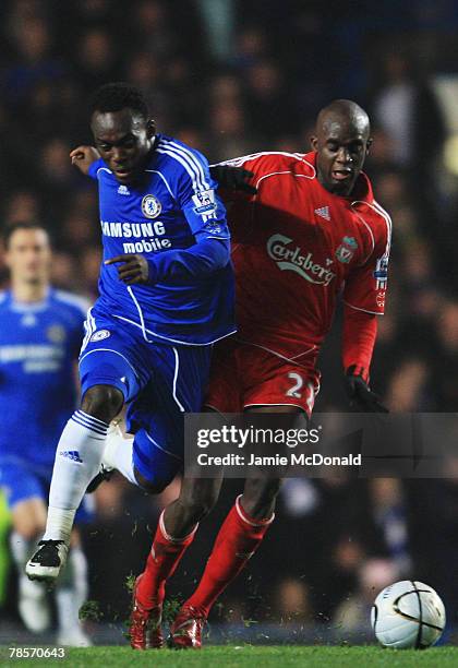 Michael Essien of Chelsea challenges Momo Sissoko of Liverpool during the Carling Cup Quarter Final match between Chelsea and Liverpool at Stamford...