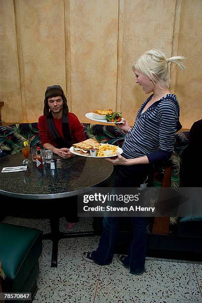S Survivor China winner Todd Herzog is served lunch by CBS's Survivor China runner-up Courtney Yates a former waitress at the Coffee Shop on December...
