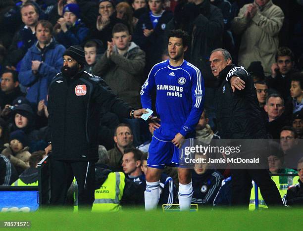 Michael Ballack of Chelsea takes instructions from his manager Avram Grant as he returns from injury to play during the Carling Cup Quarter Final...