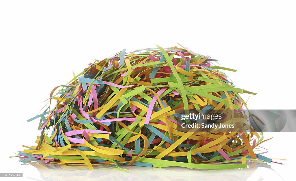 Colorful shredded paper on white