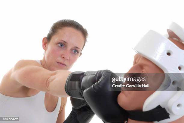 boxer executing a straight right hand on her target. - gerville foto e immagini stock