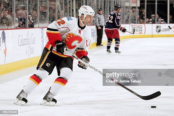 Daymond Langkow of the Calgary Flames skates with the puck against the Columbus Blue Jackets on December 18, 2007 at Nationwide Arena in Columbus,...