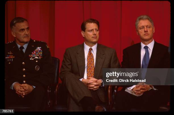 General Henry Shelton, Vice President Al Gore and President Bill Clinton sit February 17, 1998 in Washington, DC. Clinton demanded that Saddam...
