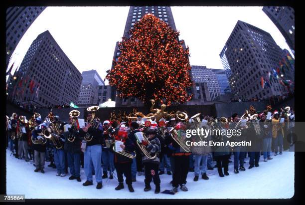 Band of tuba players perform at Rockefeller Center December 15, 1996 in New York City. Over four hundred tuba players gather for an annual Christmas...