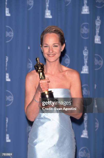 Actress Helen Hunt holds her Oscar at the Academy Awards March 23, 1998 in Los Angeles, CA. Hunt won the 1998 Best Actress Oscar for her role as...
