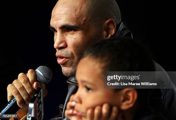 Anthony Mundine sits with his son Rahim during a press conference at the Sydney Entertainment Centre on December 20, 2007 in Sydney, Australia....