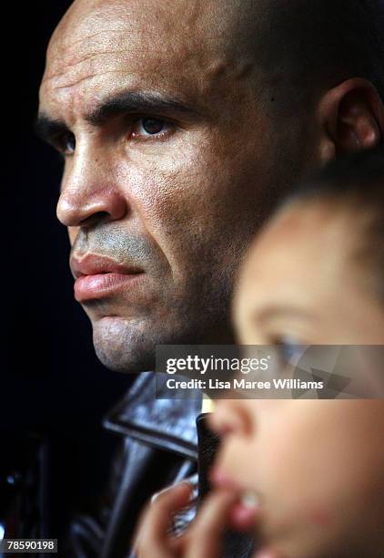 Anthony Mundine sits with his son Rahim during a press conference at the Sydney Entertainment Centre on December 20, 2007 in Sydney, Australia....