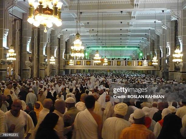 Muslim pilgrims perform the Sa'y from Safa to Marwah hills after the circumambulation of the Kaba in the holy city of Mecca, Saudi Arabia 19 December...
